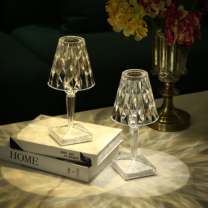 Rechargeable portable LED atmosphere lamp providing warm ambient lighting on a modern bedside table