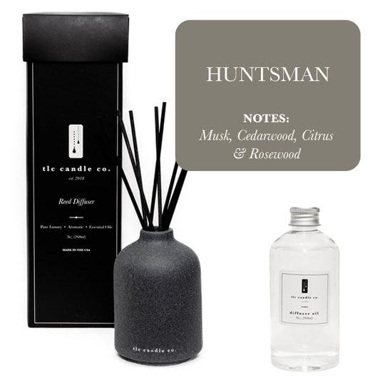 Huntsman reed diffuser with natural rattan sticks decorating a modern living room table