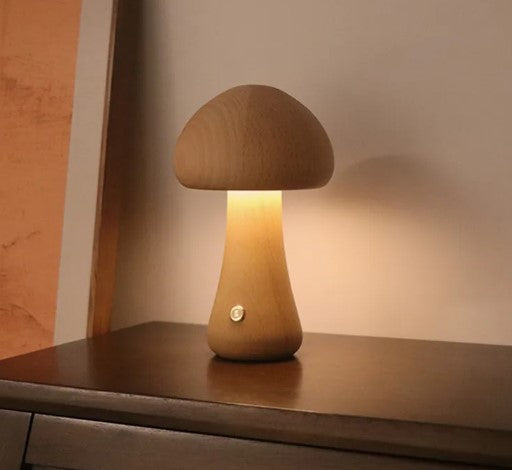 Modern mushroom table lamp with warm LED ambient lighting on a bedside table