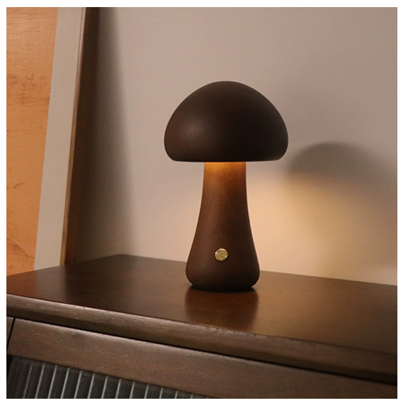 Modern mushroom table lamp with warm LED ambient lighting on a bedside table