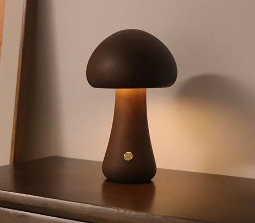 Modern mushroom table lamp with warm LED ambient lighting on a bedside table