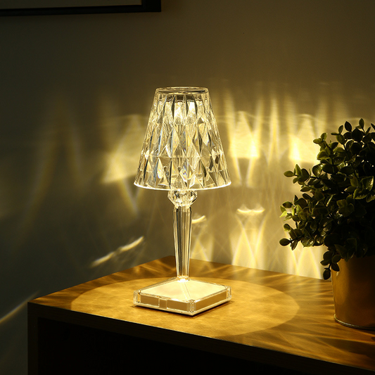 Rechargeable portable LED atmosphere lamp providing warm ambient lighting on a modern bedside table