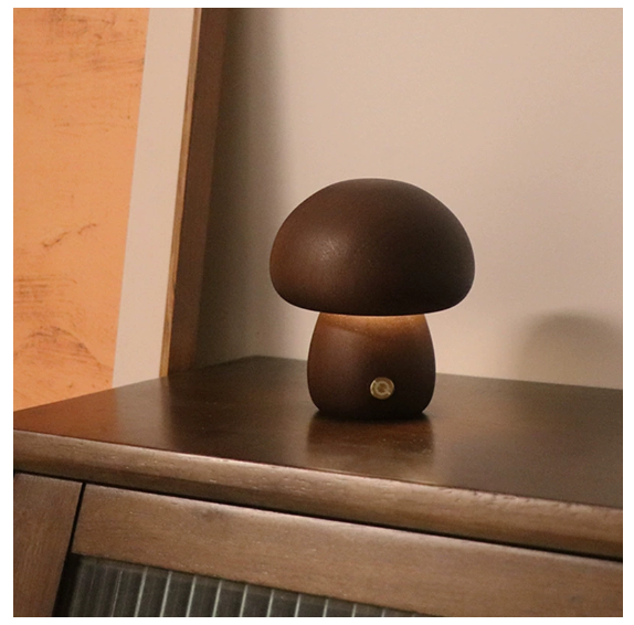 Modern mushroom table lamp with warm LED ambient lighting on a bedside table