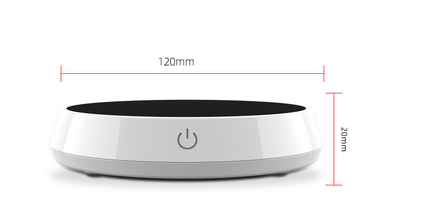 Smart coffee mug warmer keeping a ceramic coffee cup at the perfect drinking temperature on an office desk