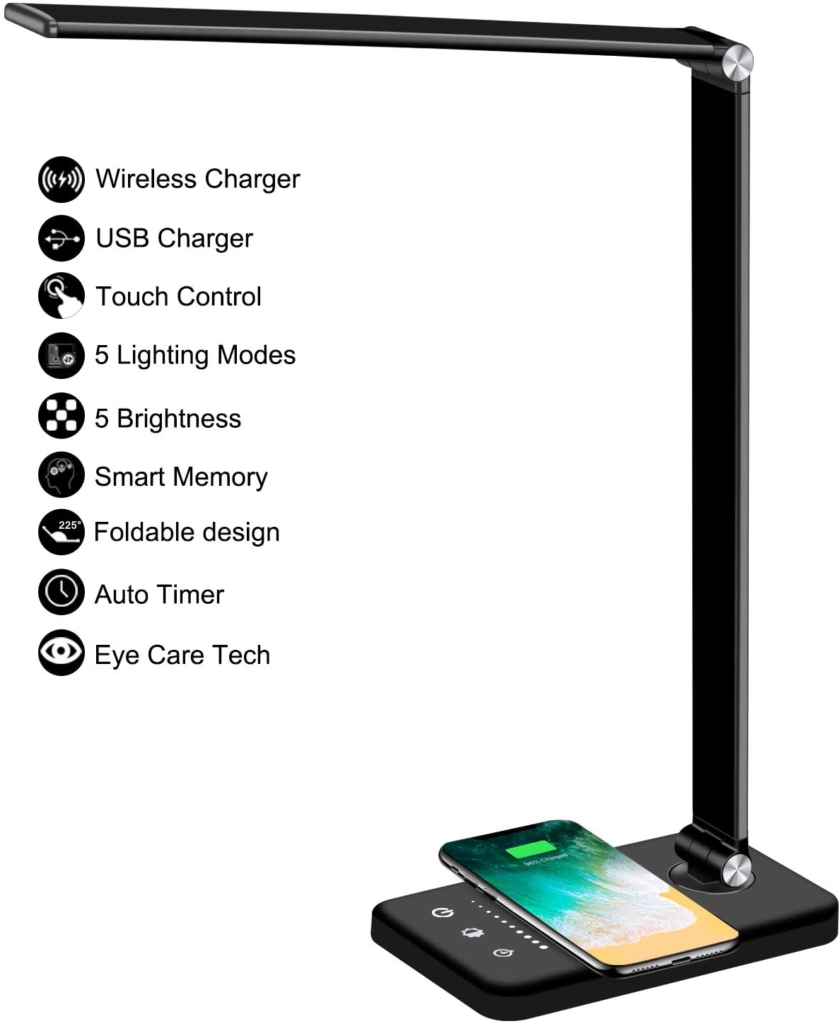 Modern LED desk lamp with wireless phone charger illuminating a minimalist office desk